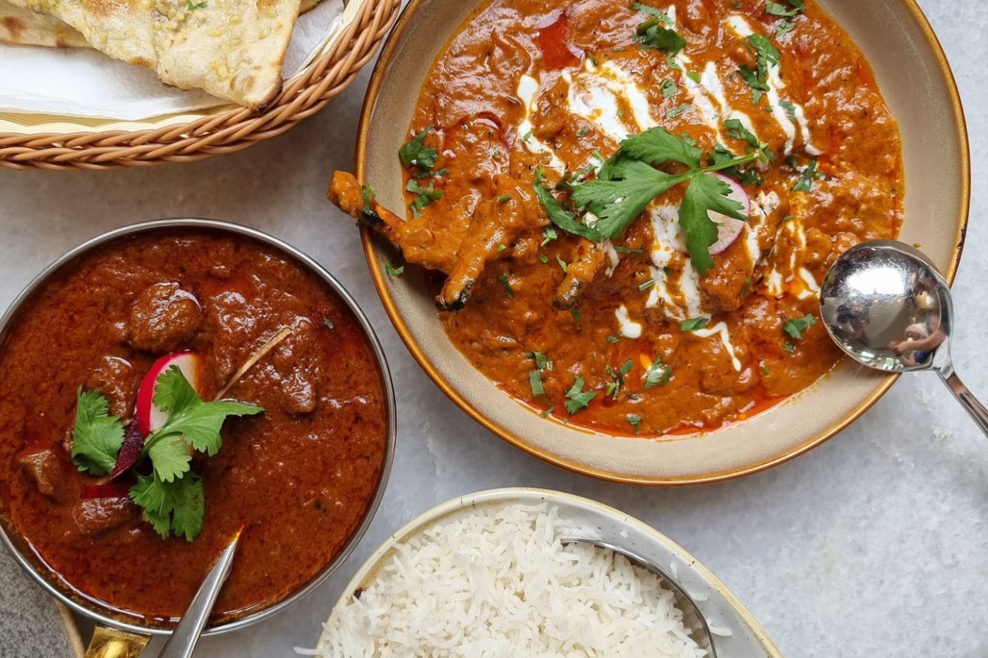 Overhead shot of two Indian curry dishes