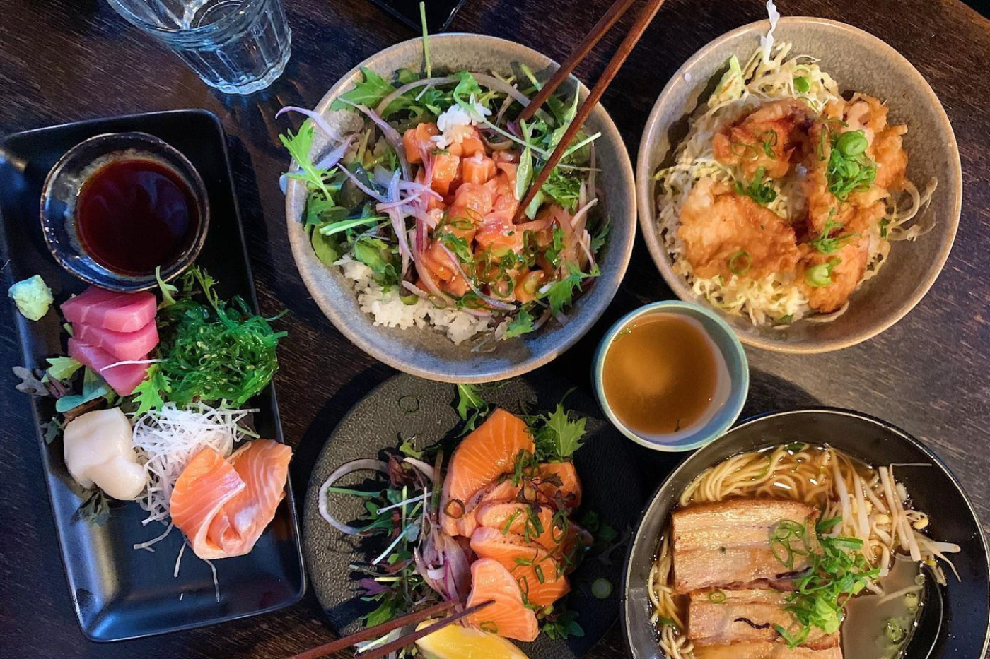 Overhead shot of Japanese dishes and sashimi