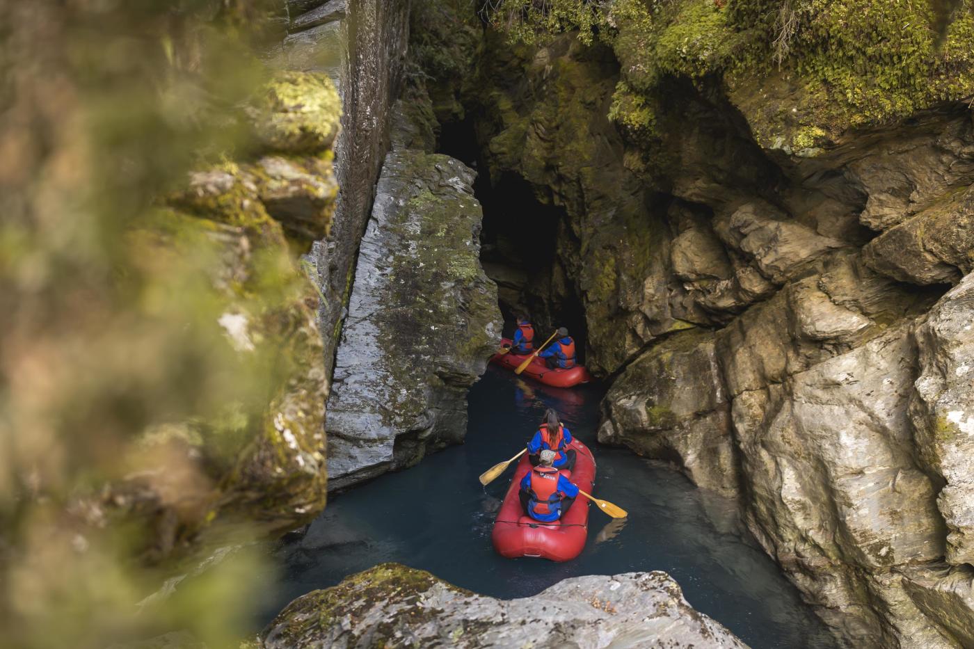 Group of people on inflatable Funyaks going into a chasm