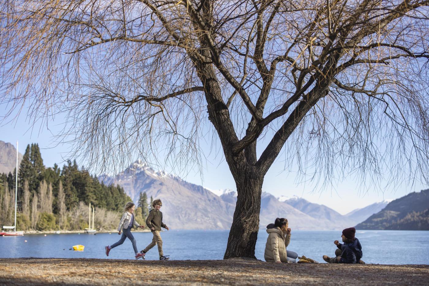 Family enjoying themselves on Queenstown Beach in spring