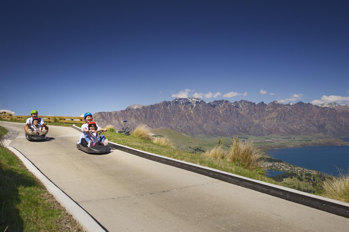 Family on a luge ride at Skyline Gondola Queenstown