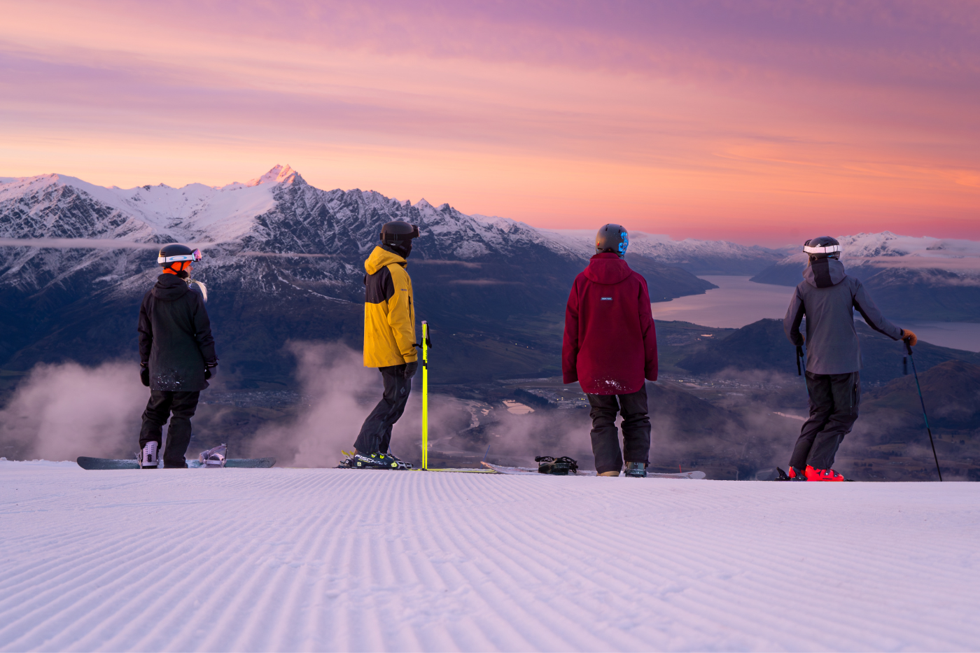 Skiers watching the sunrise at Coronet Peak