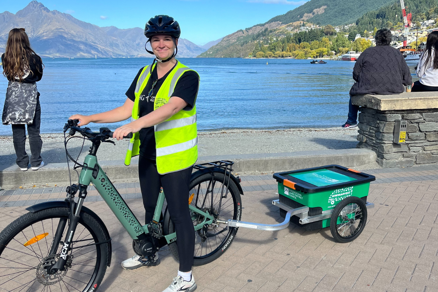 Katie Robertson on an e-bike as a food rescue volunteer for KiwiHarvest