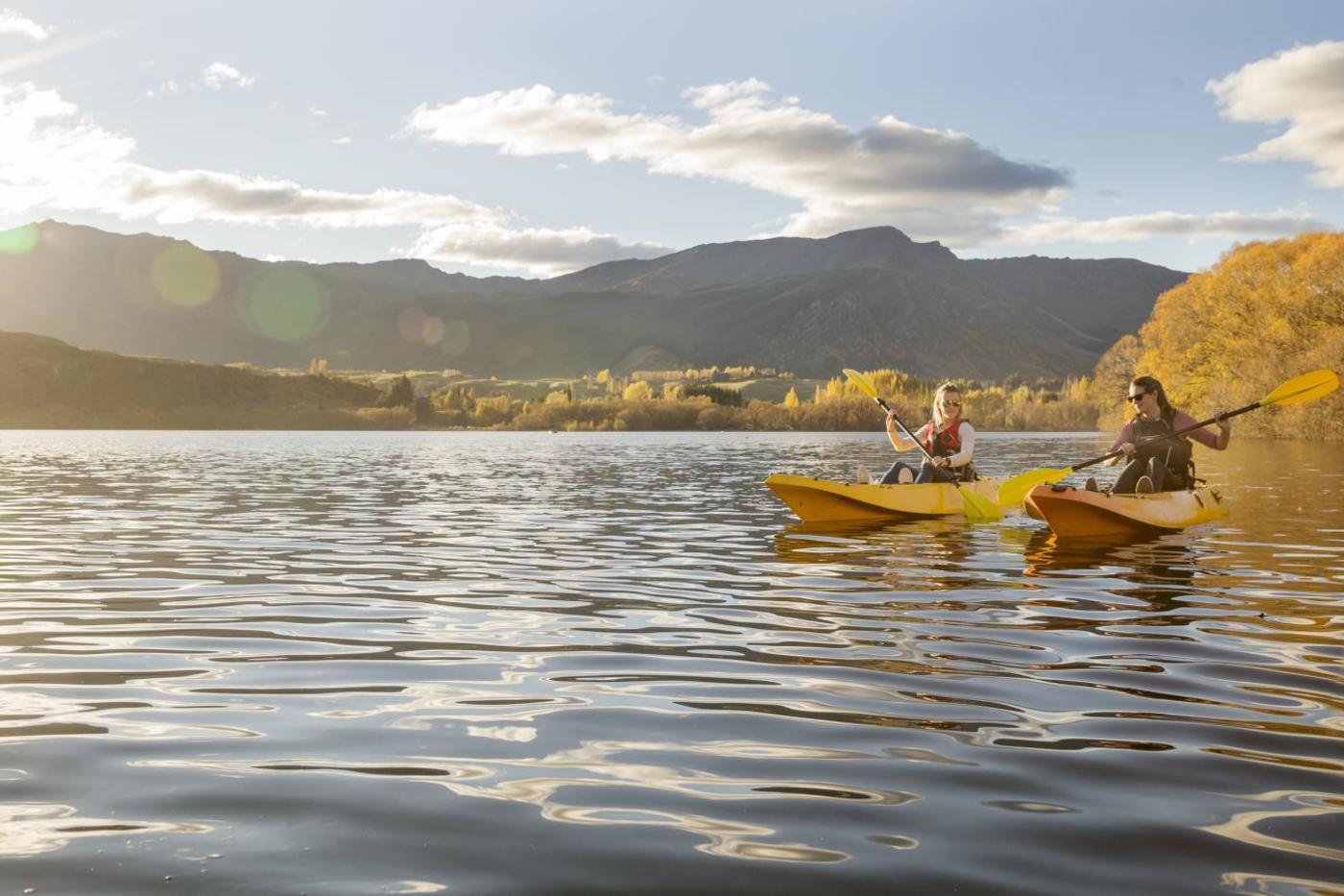 Friends Kayaking on Lake Hayes on an Autumn Day