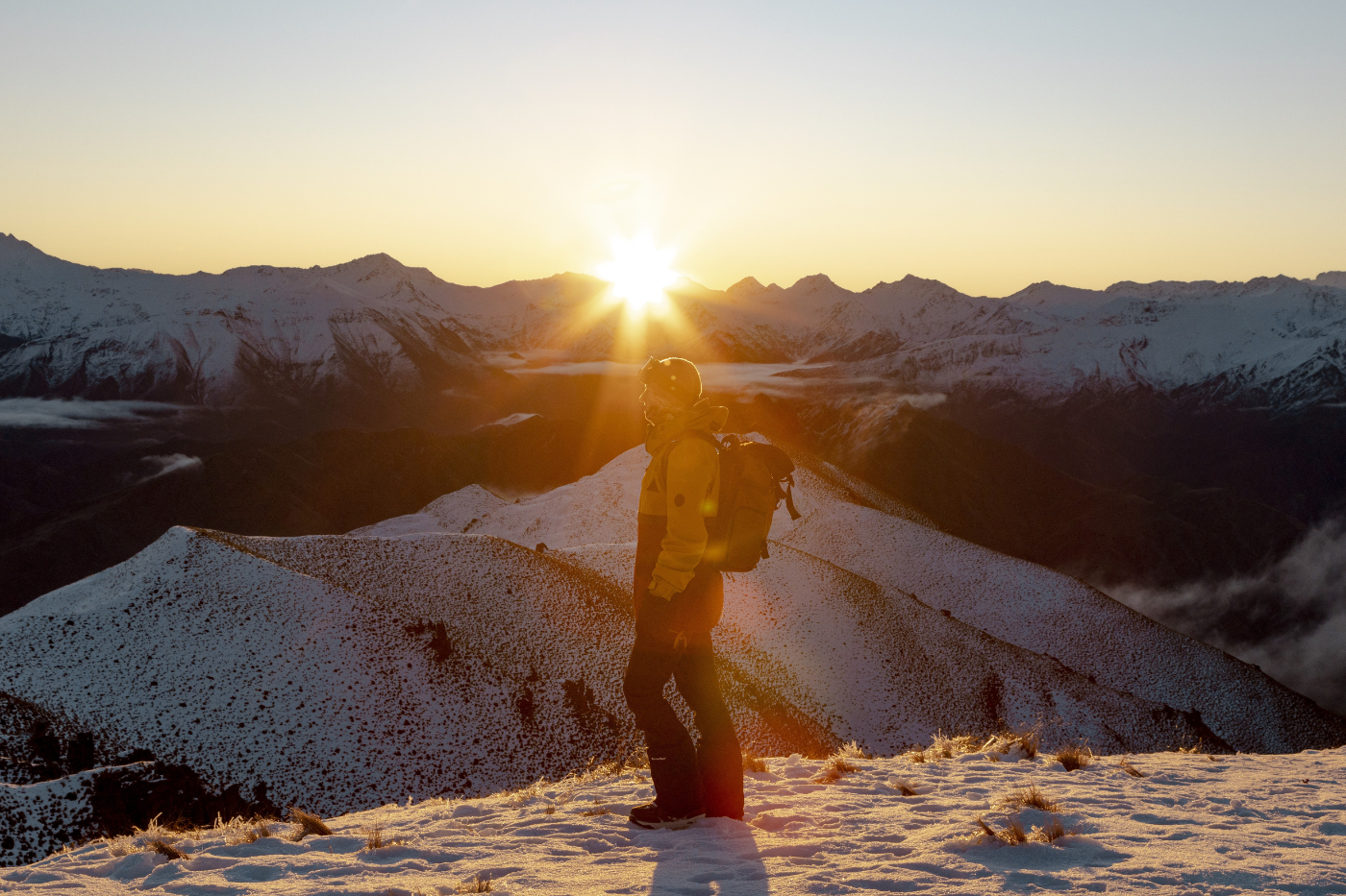 Krista May in the snow on Coronet Peak at sunset