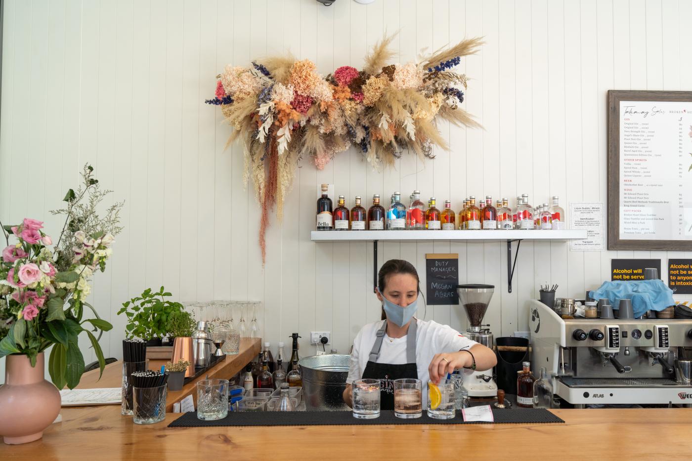 Waitress creating cocktails at Gin Garden, by Broken Heart Spirits