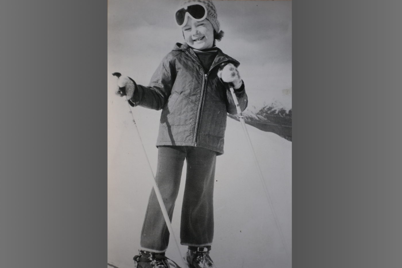 Black and white photograph of Sheena skiing as a 5-year-old