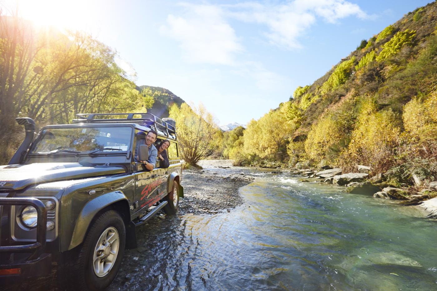 Nomad Safaris truck crossing river in Autumn