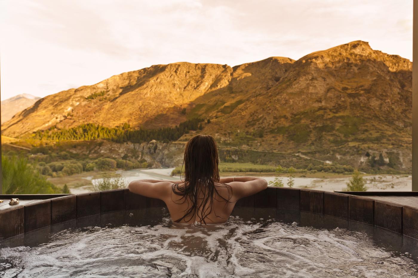 Woman relaxing at Onsen Hot Pools, Queenstown