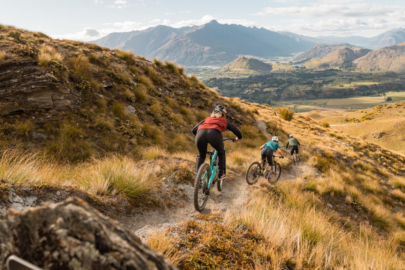 Mountain bikers downhill on Pack Sack & Track, Mountain Bike Trail, Coronet Peak