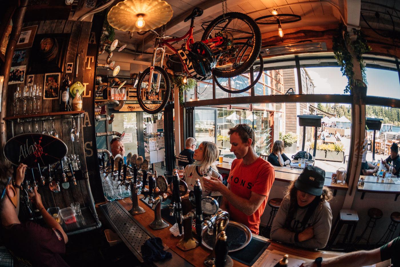 Mountain bikers ordering a drink at Atlas Beer Cafè