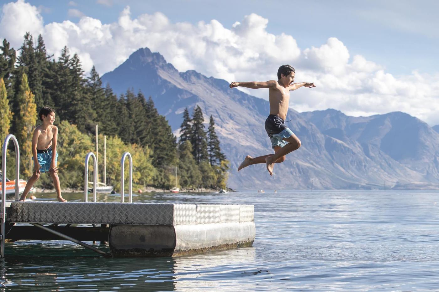 Boy jumping into Lake Whakatipu