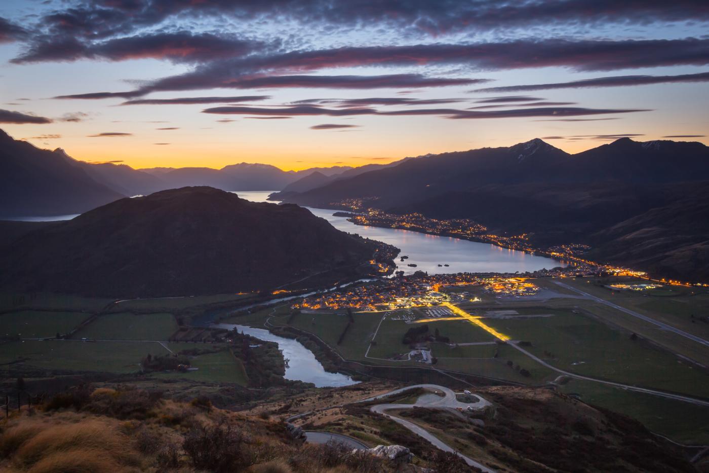Aerial photo of the Queenstown Airport runway at sunset
