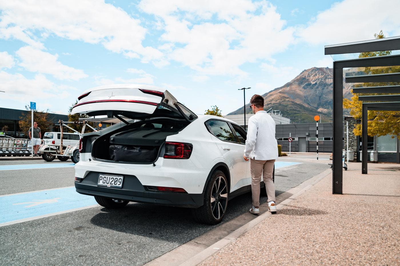 Driver picking up an electric car at Queenstown Airport