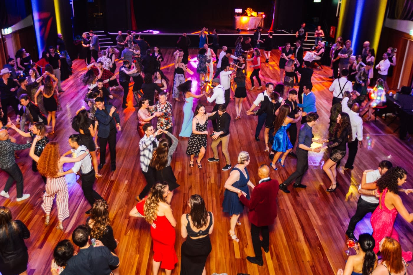 A room of people salsa dancing at the Queenstown Salsa Festival