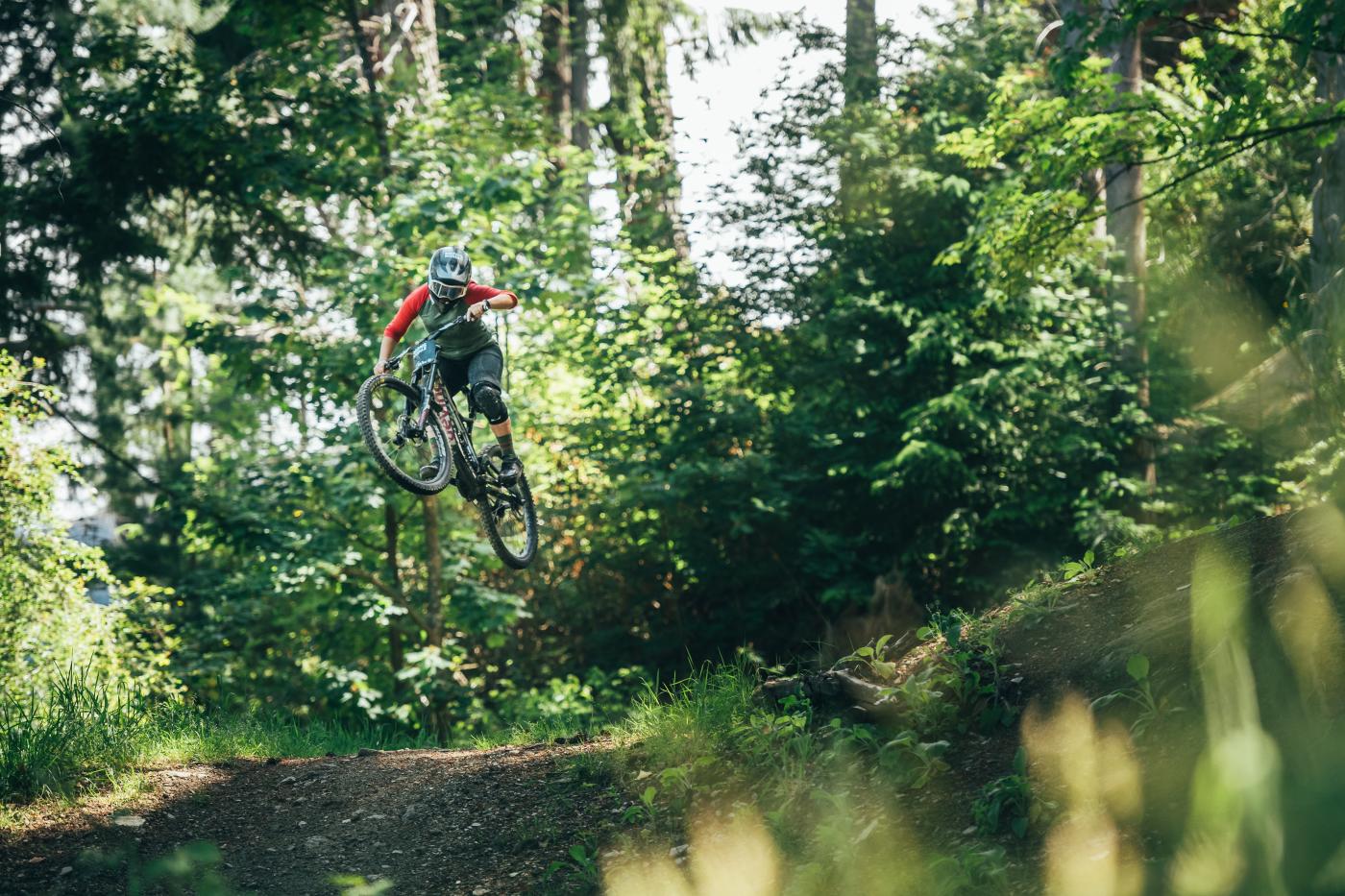 Female MTB rider jumps at Queenstown Bike Park