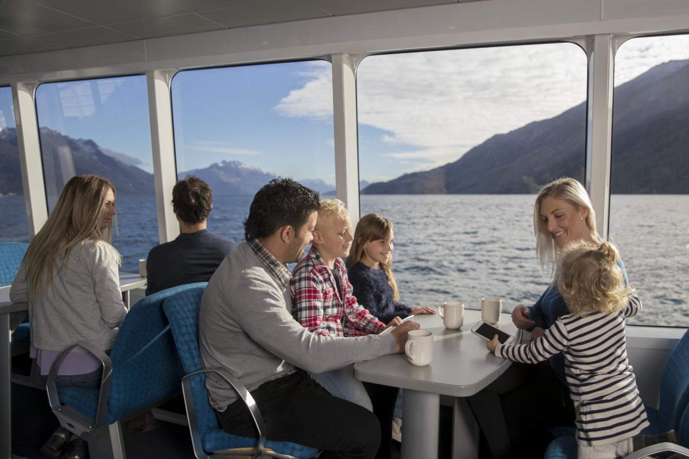 Family seated on the Spirit of Queenstown Scenic Cruise