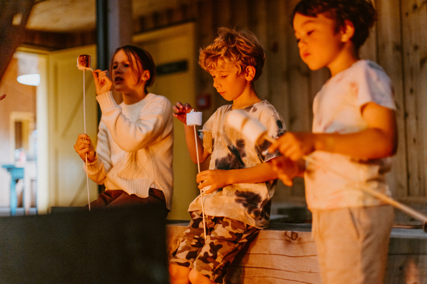 Children roasting marshmallows at The Great Glenorchy Alpine Base Camp