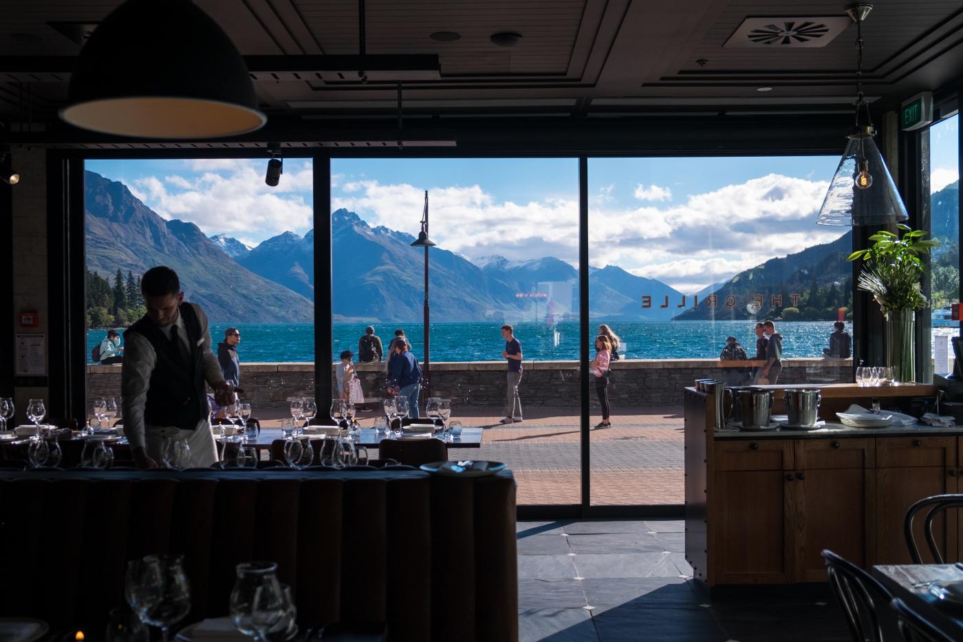 Interior view of The Grille Restaurant looking over Lake Whakatipu and mountains