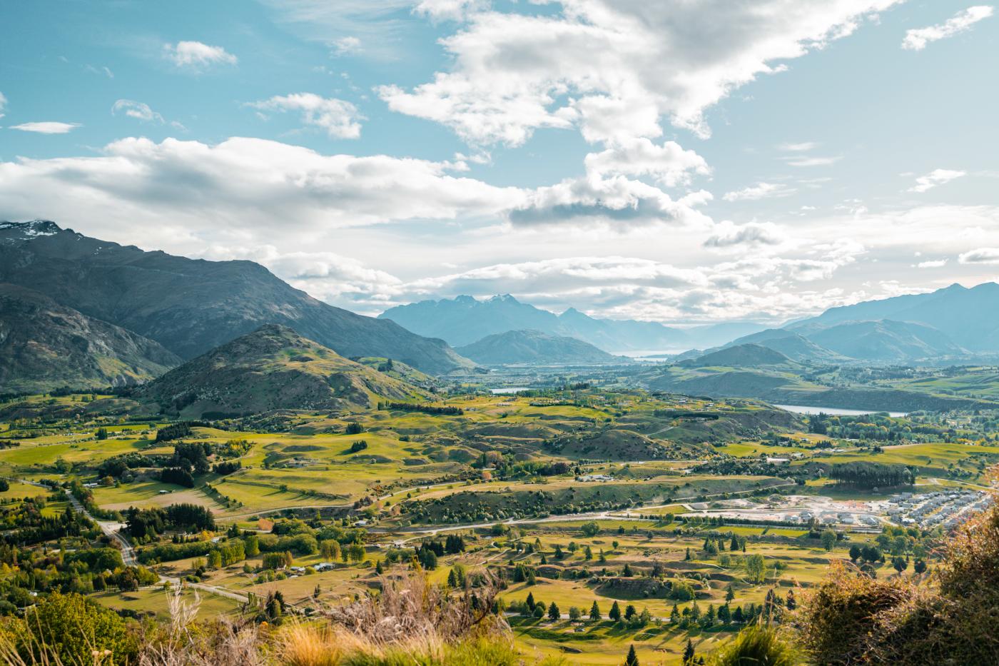 View from Tobin's Track of green valley with mountains in the distance