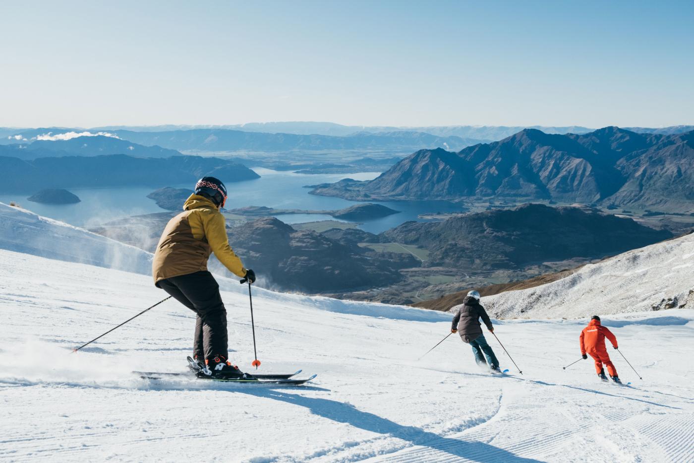 Three skiers on mountain