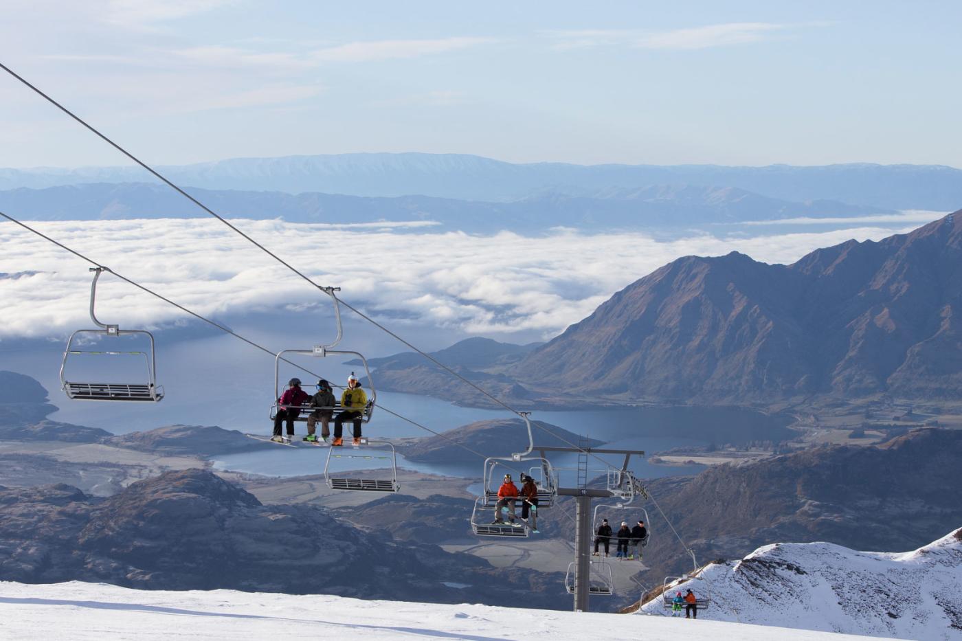 People riding the chairlift at Treble Cone Ski Field, Wānaka