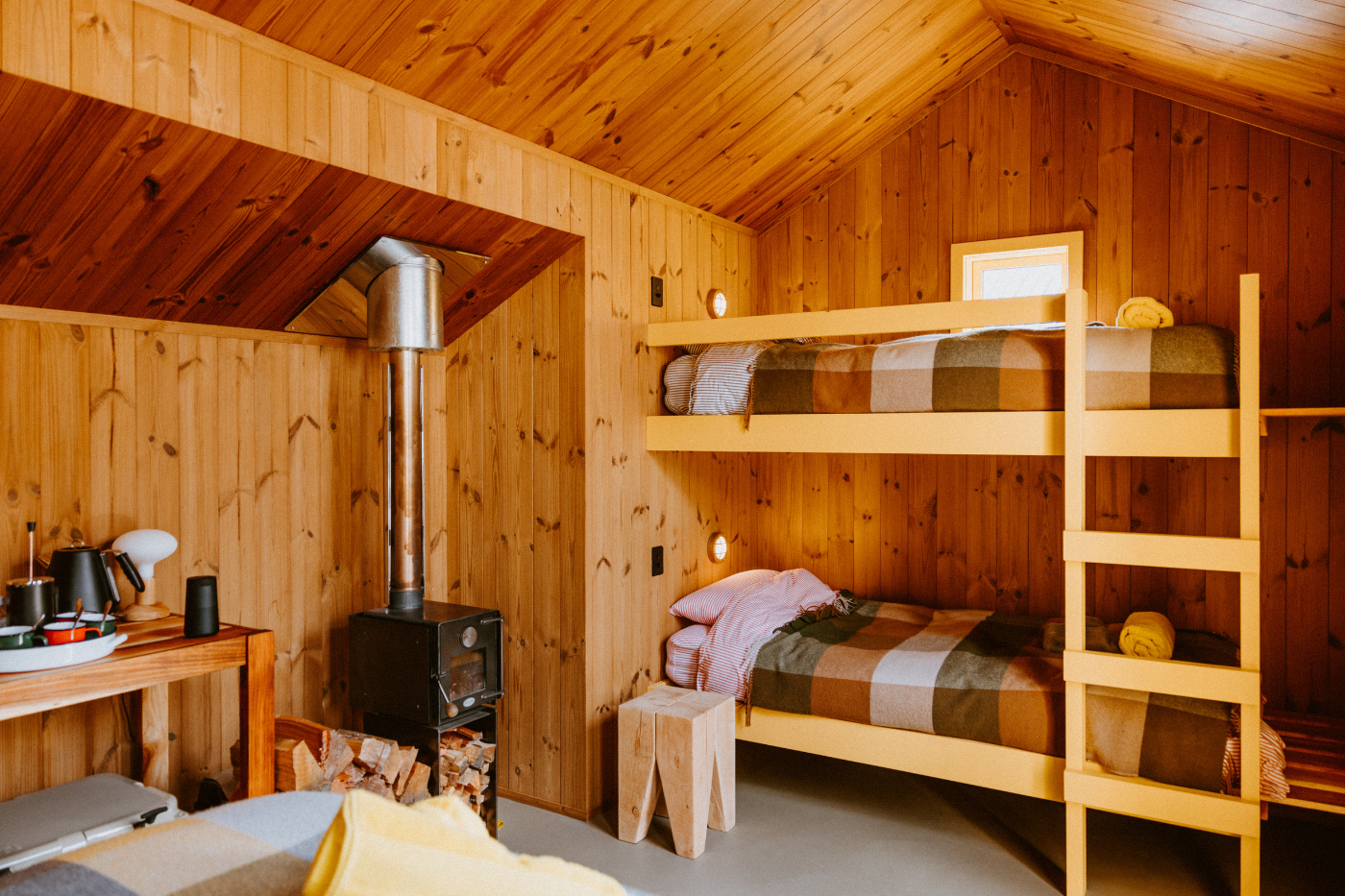 Wood cabin with bunk beds accommodation at The Great Glenorchy Alpine Base Camp