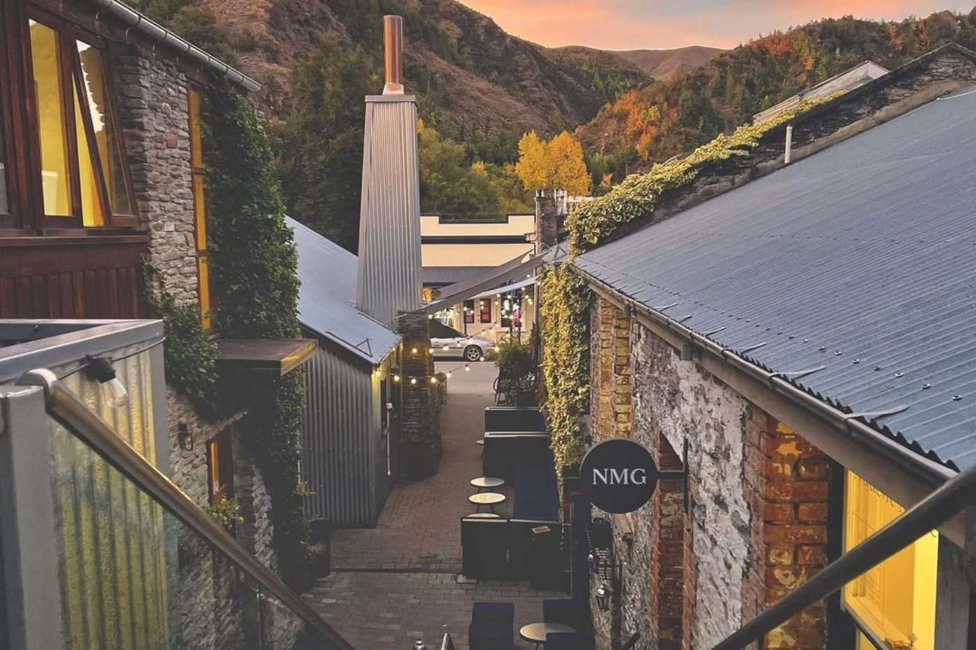 Alleyway view of Arrowtown shops at sunset