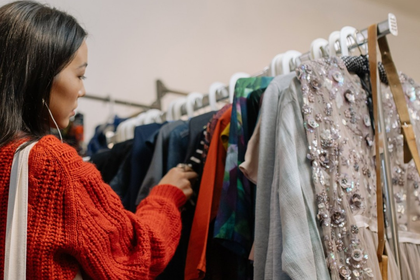 Lady browsing clothes rack