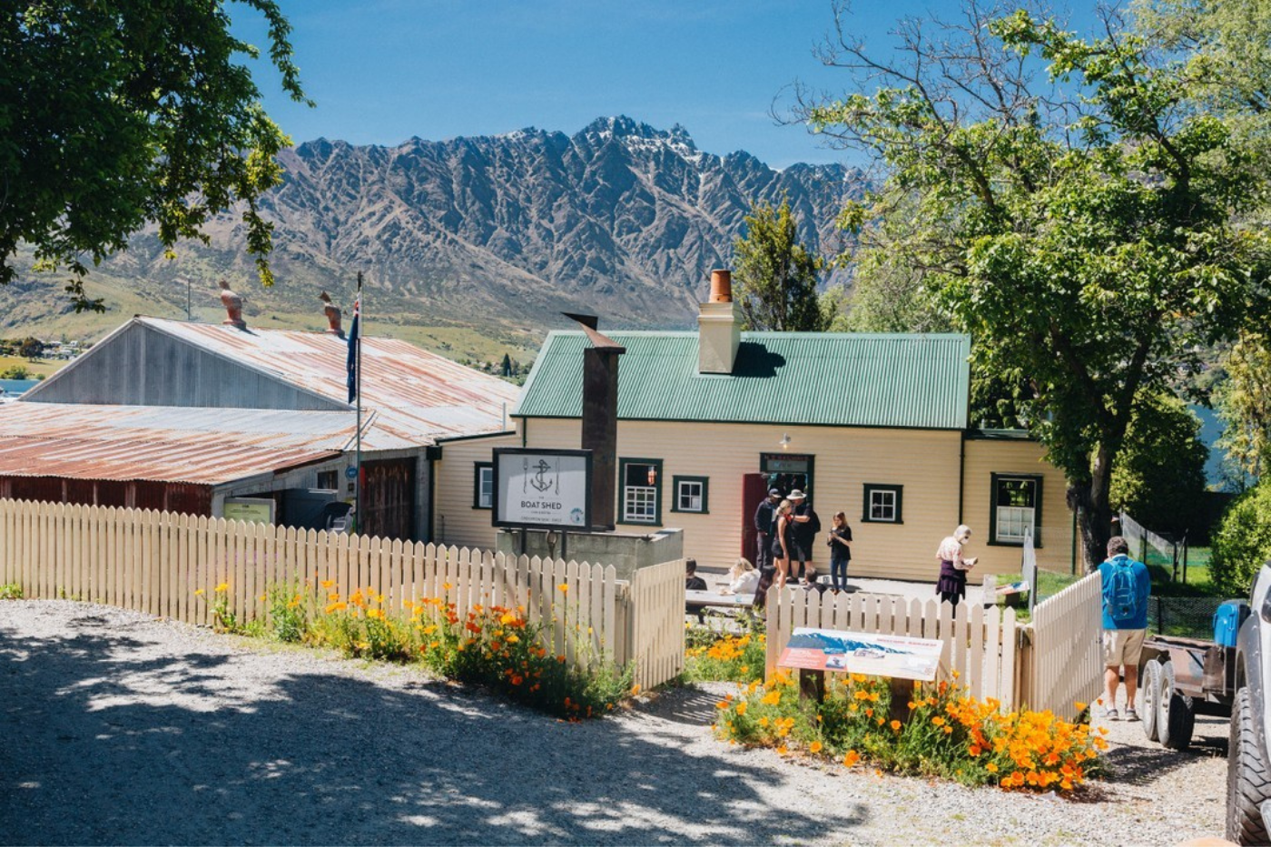 Exterior of the Boat Shed Cafe with mountain in background