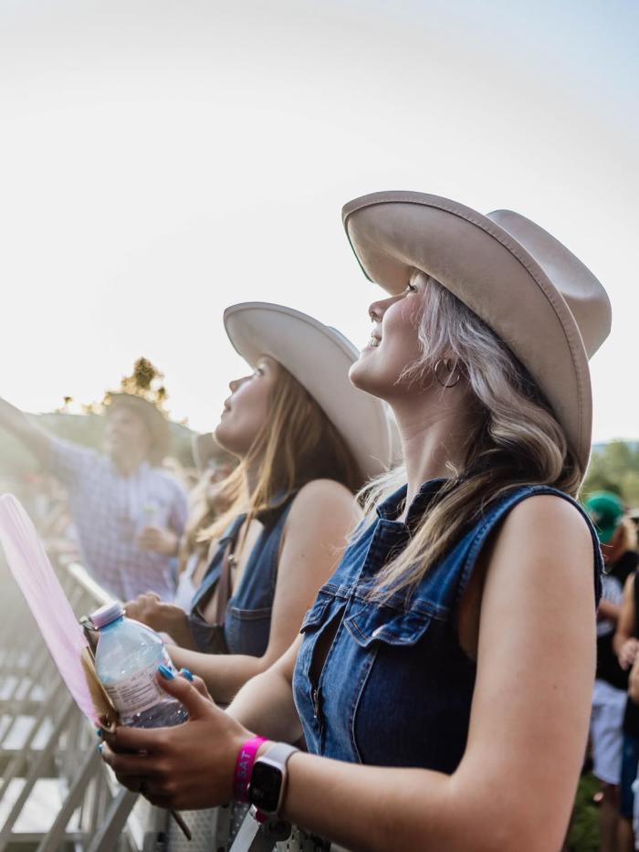 Women in Cowboy Hats at a Concert