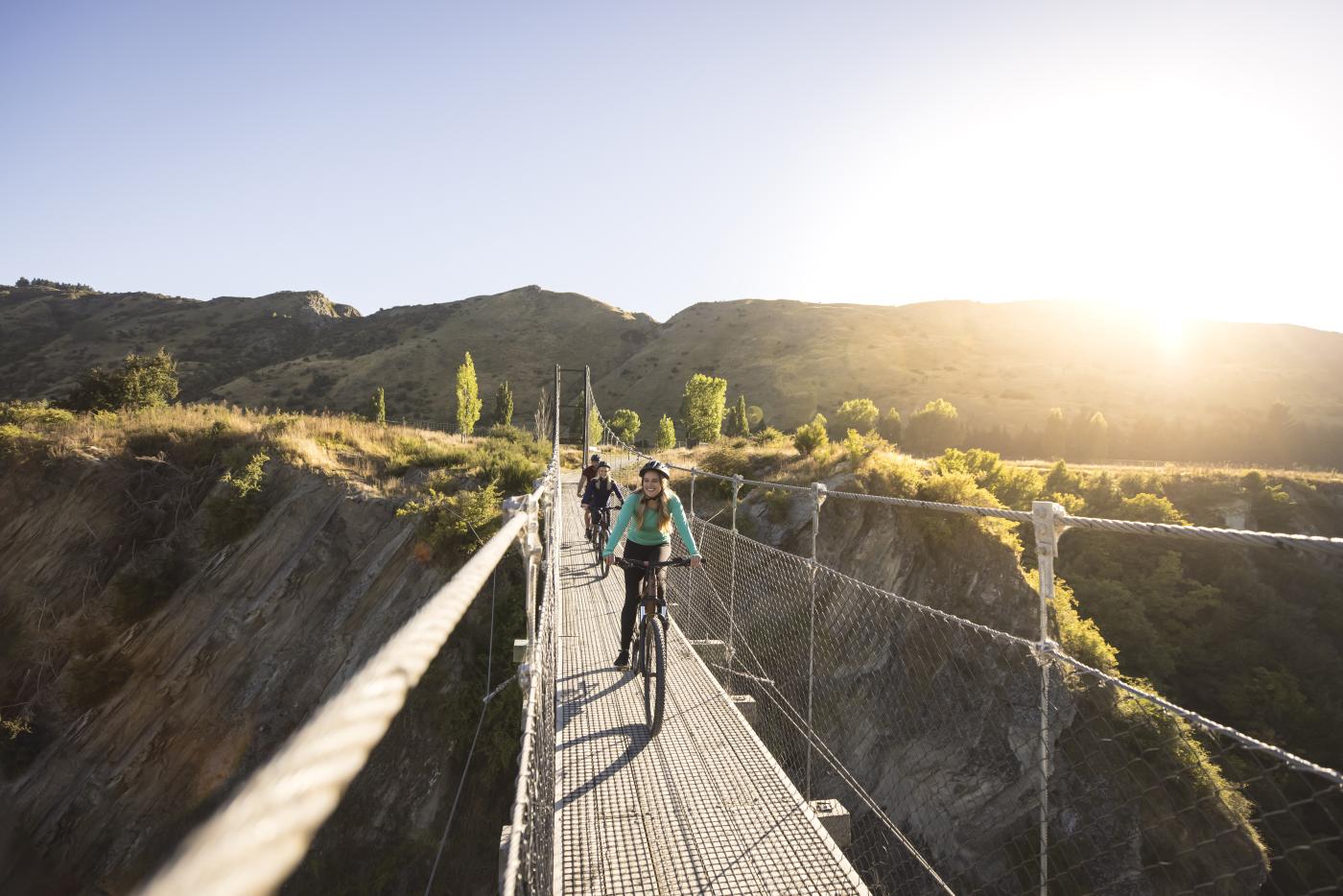 Biking across the Edgar Bridge on the Arrow River Bridges Trail