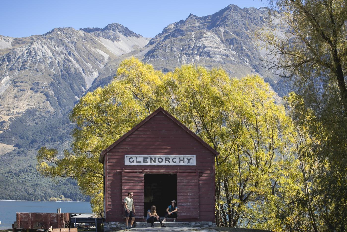 Friends sitting outside the Glenorchy Red Shed