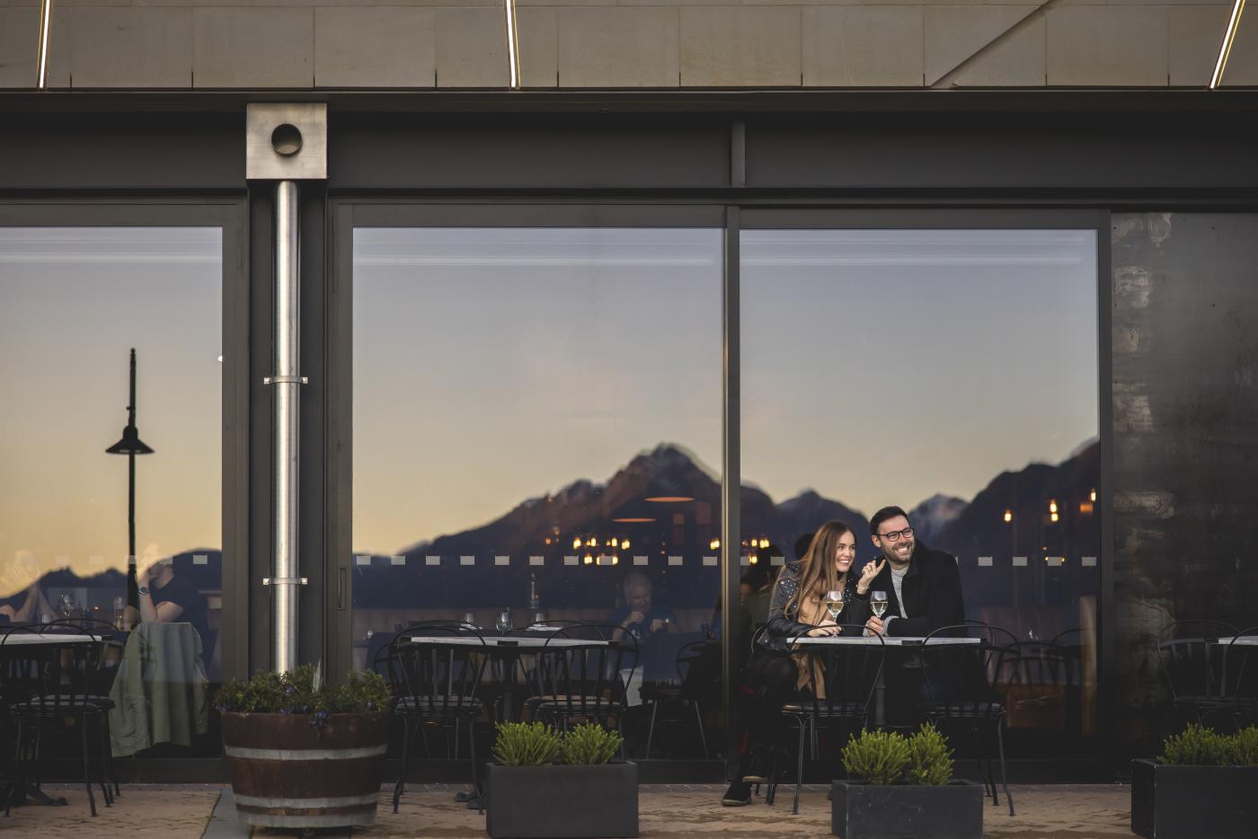 Two people dining out front of The Grille by Eichardt's Restaurant