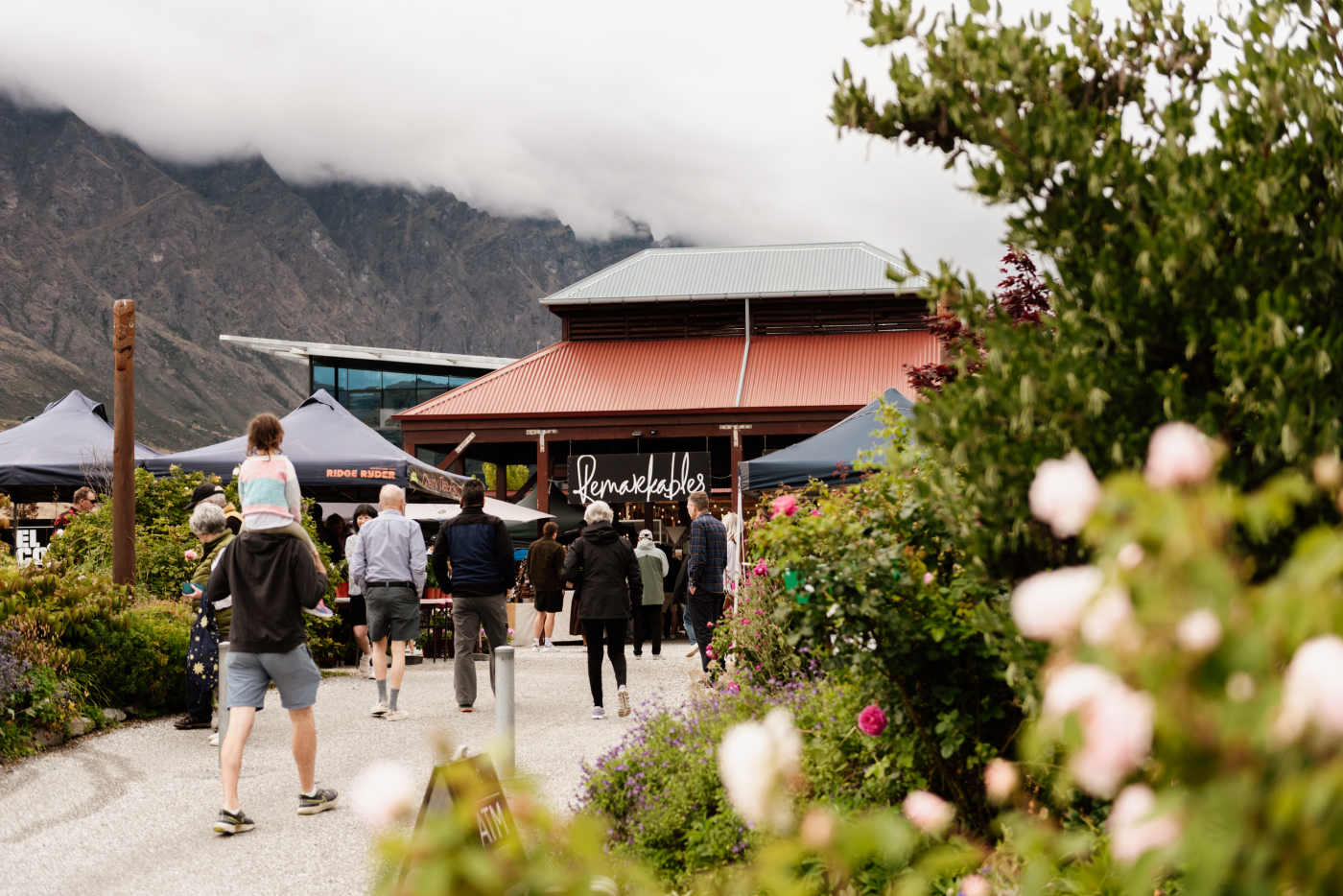 People walking into the Remarkables Market