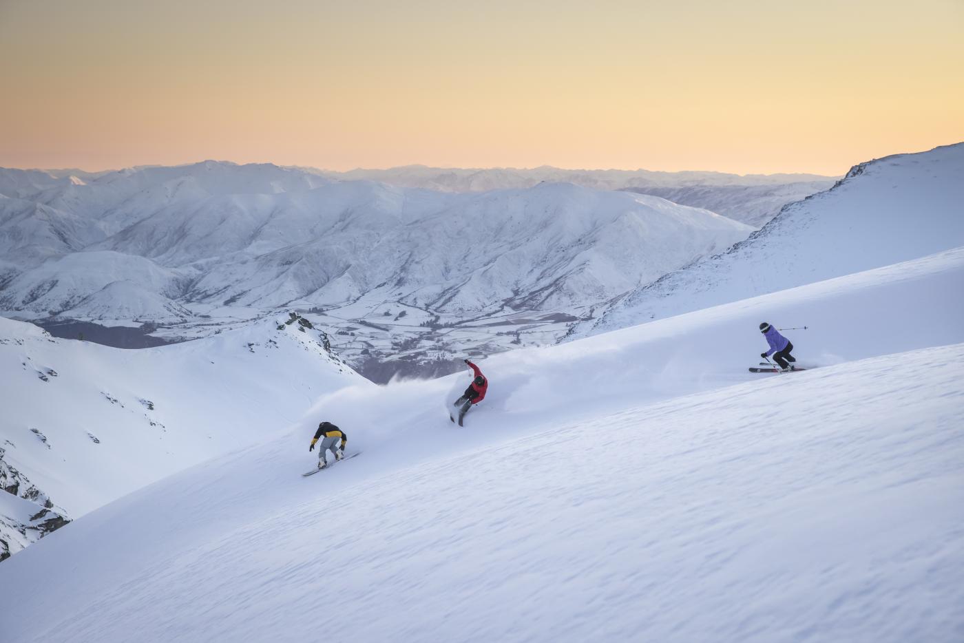 Group Skiing at The Remarkables Ski Field at sunrise