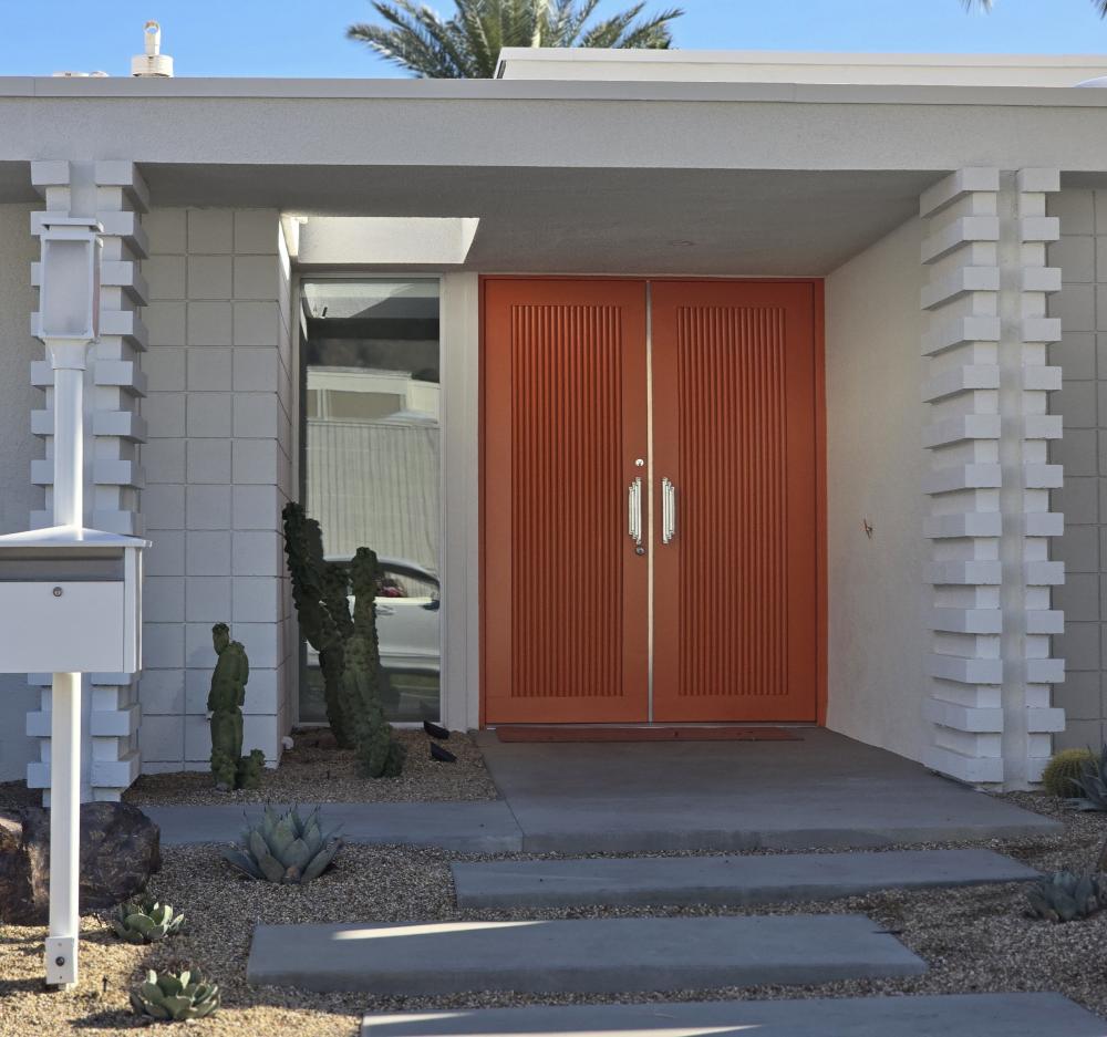 Marigold colored orange door at 2688 Kings Road East