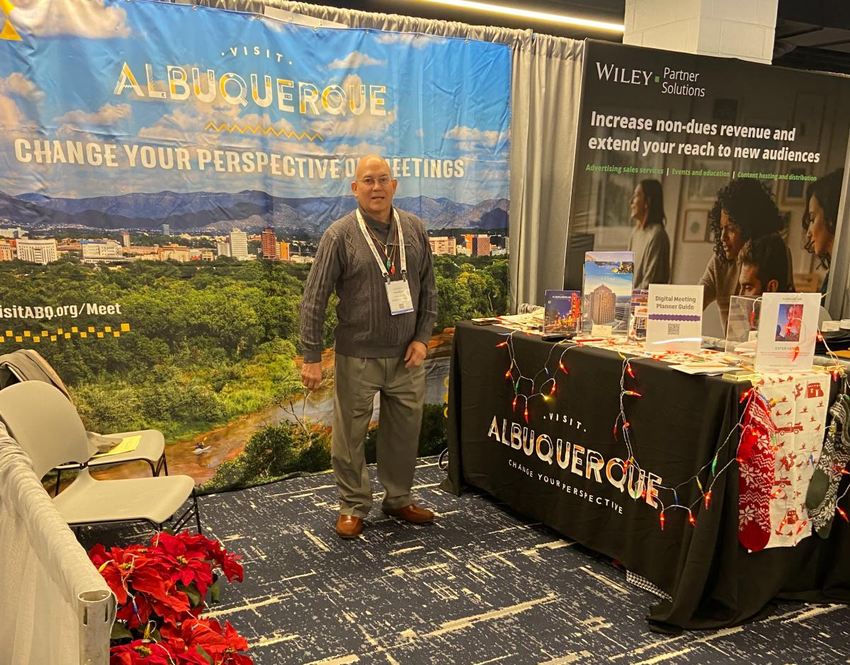 An attendee visits the Visit Albuquerque booth at the Association Forum's Holiday Showcase in Chicago