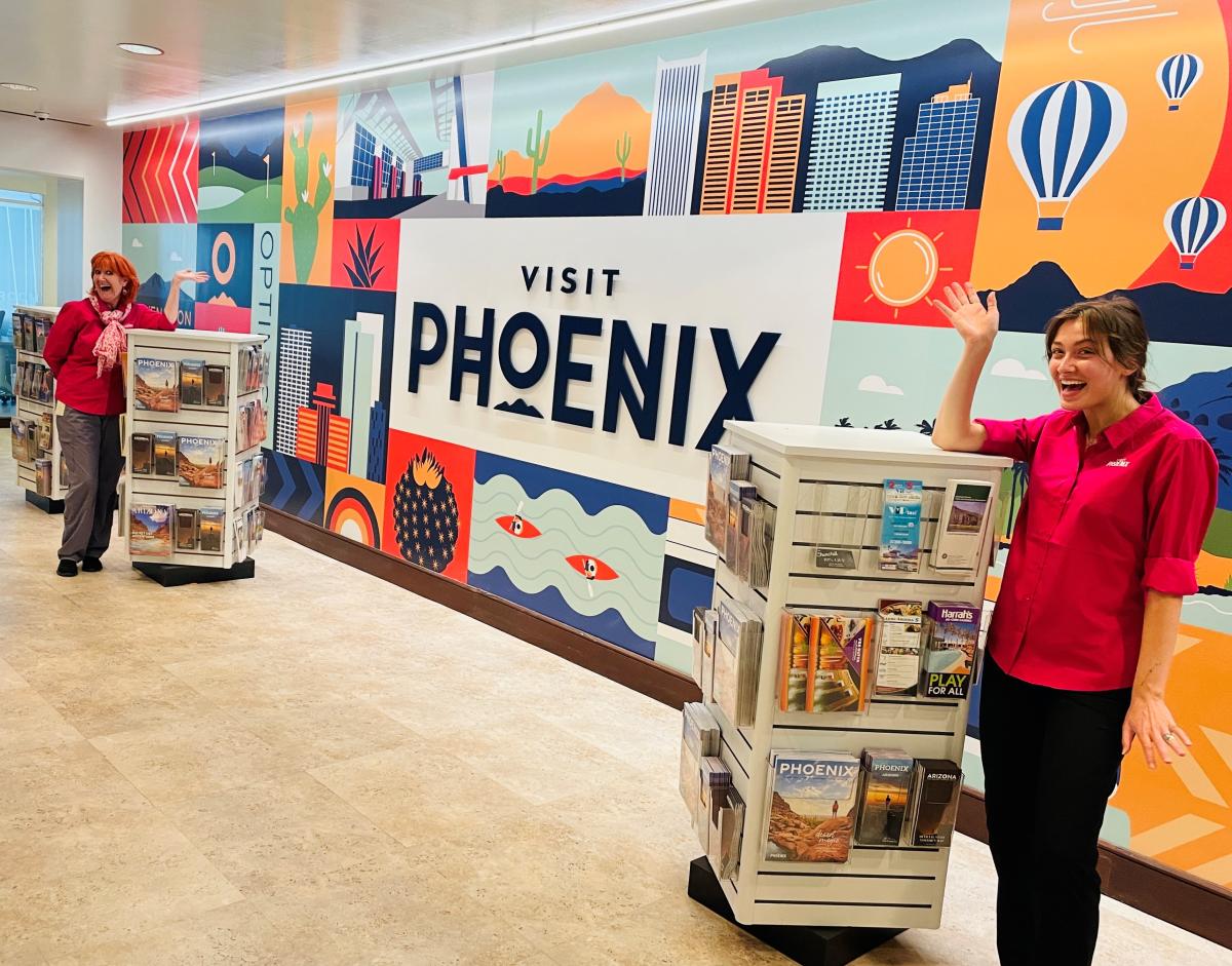 Destination experts wave in the Visit Phoenix Visitor Center