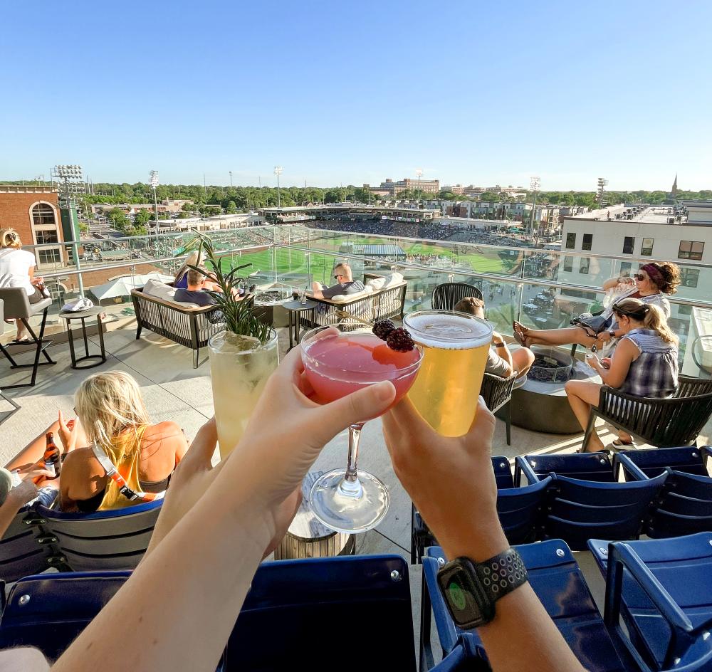 three drinks at conners rooftop overlooking the field