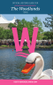 The Woodlands Visitors Guide Cover 2021 features a swan boat in front of The Woodlands Waterway Arts Festival and The Cynthia Woods Mitchell Pavilion.
