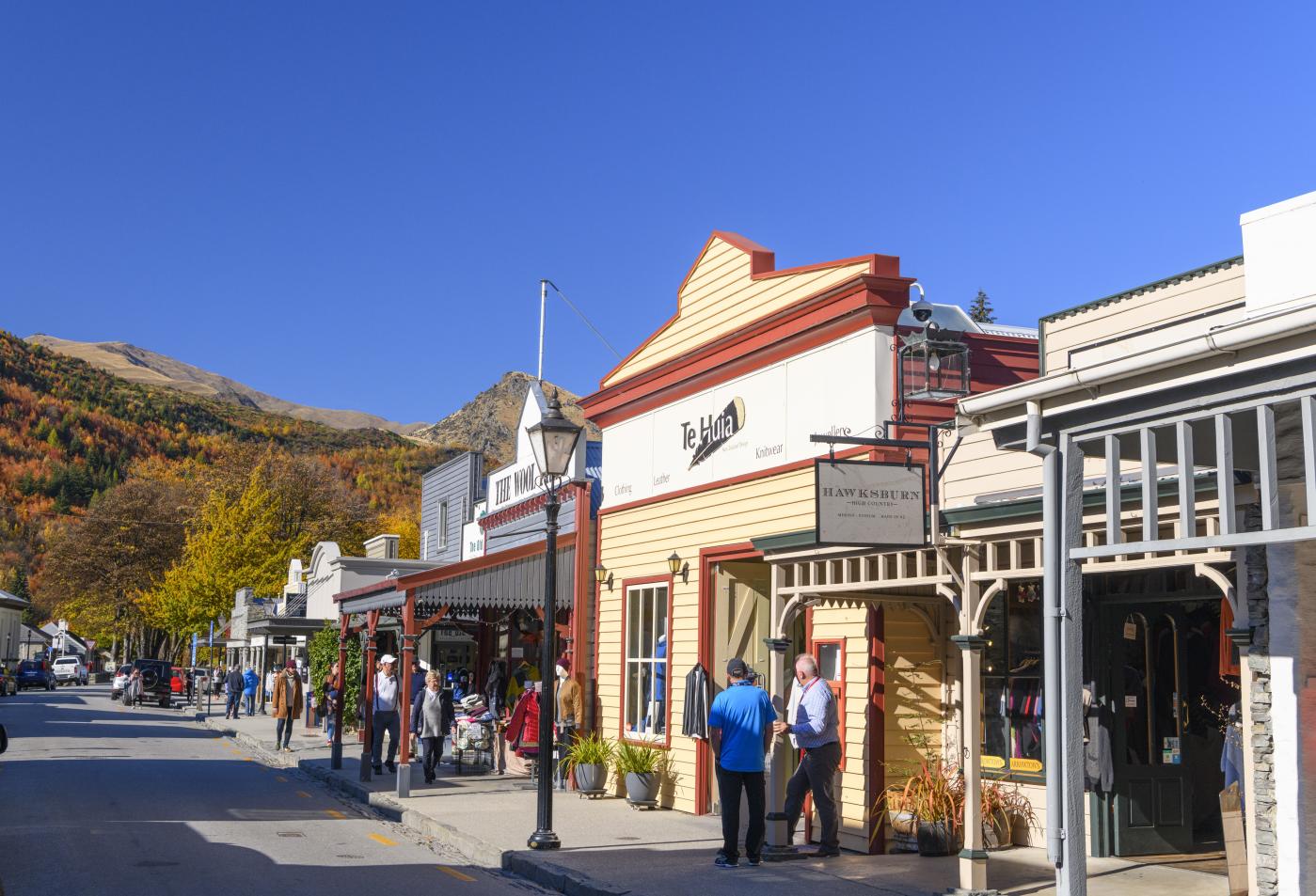 Shoppers walking along Buckingham Street, Arrowtown in Autumn