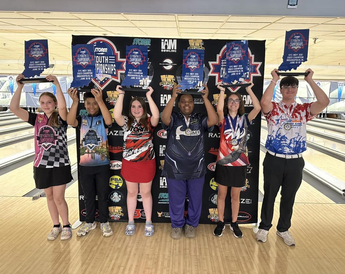 People holding trophies