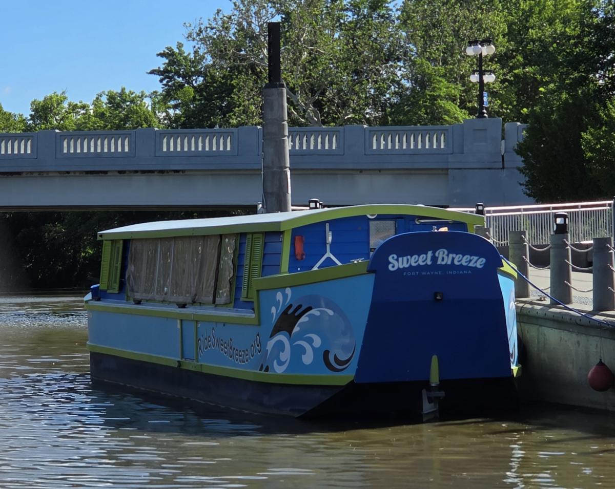 Blue and green Sweet Breeze canal boat in Fort Wayne, Indiana