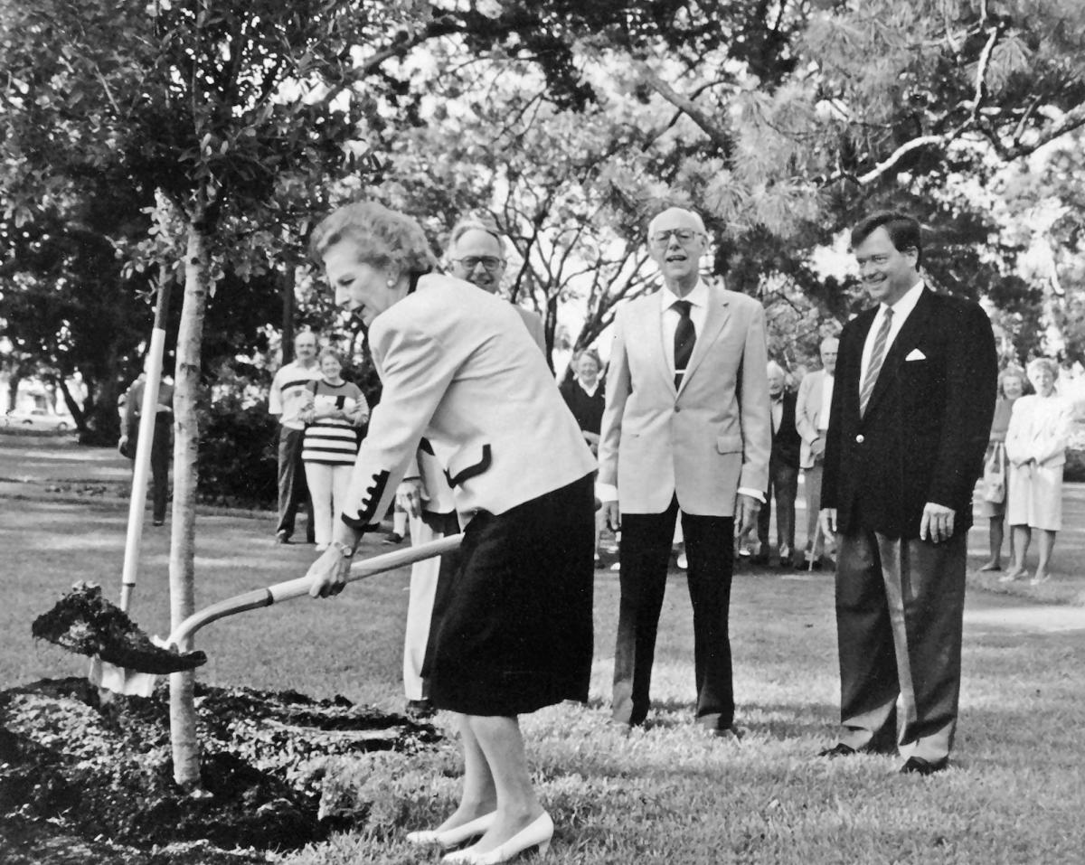 Prime Minister Margaret Thatcher plants a live oak tree at Sea Island, GA