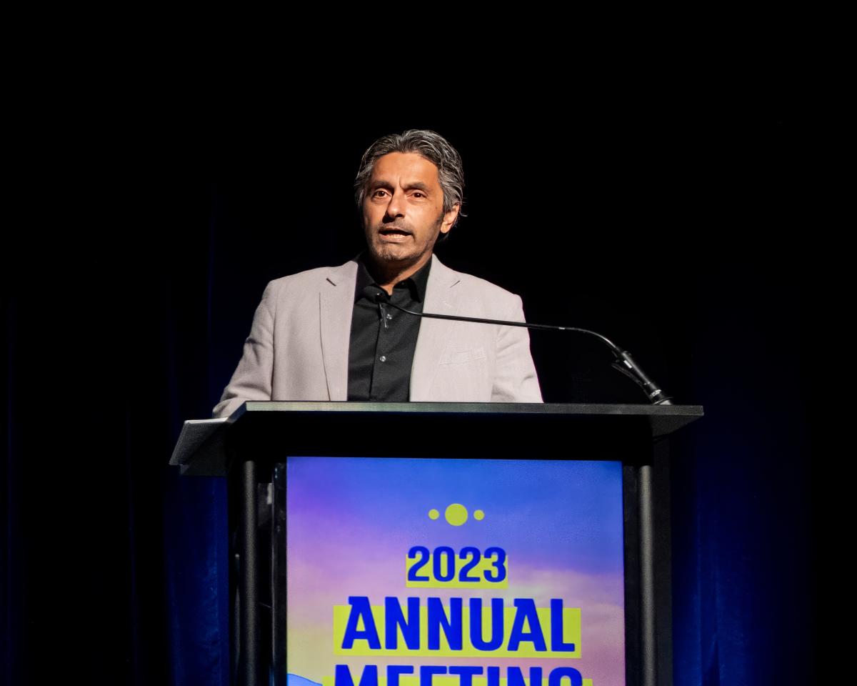 Deepesh Kholwadwala, owner and President/CEO of Sun Capital Hotels, speaks at the 2023 Visit Albuquerque Annual Meeting