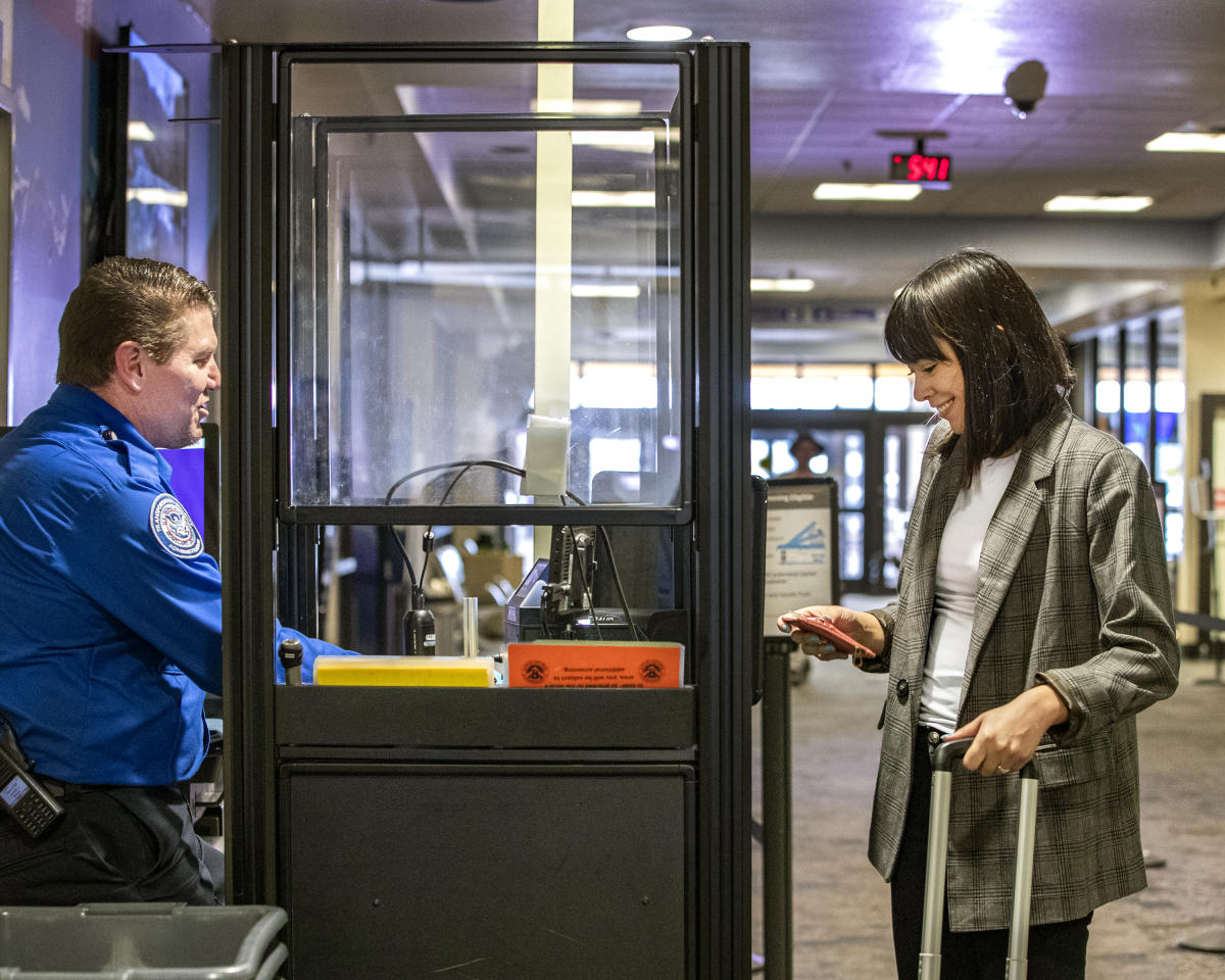 A woman going through security at Durango - La Plata Country Airport with no line.