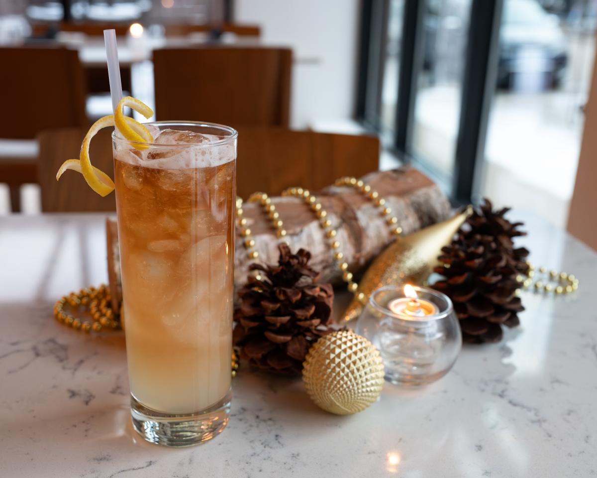A festive cocktail posed with holiday decor