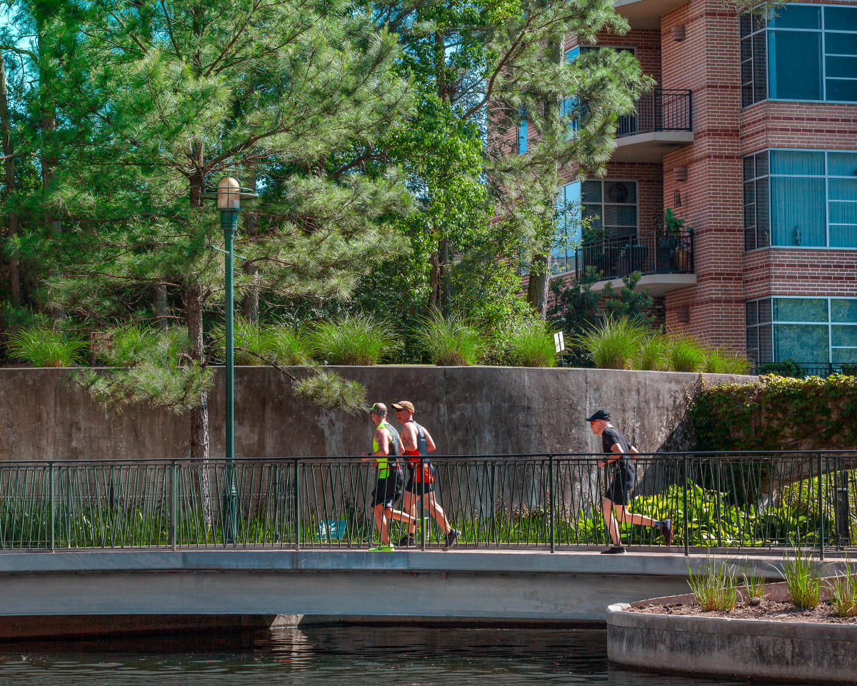 Runners Along The Woodlands Waterway