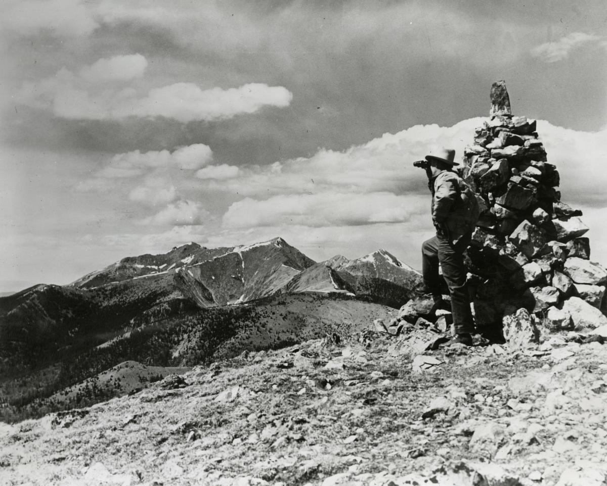 A 1940 New Mexico Magazine photo of a man looking at the Truchas Peaks from the Pecos Mountains